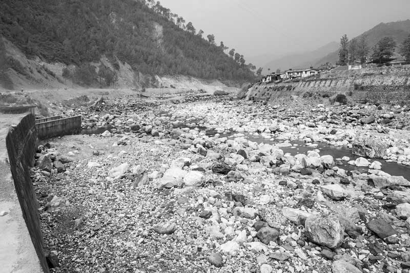 Challenges Impacting the Connection between Water and Religion - Dried bed of river Bhagirathi - the headstream of holy river Ganga - at Uttarkashi, Uttarakhand